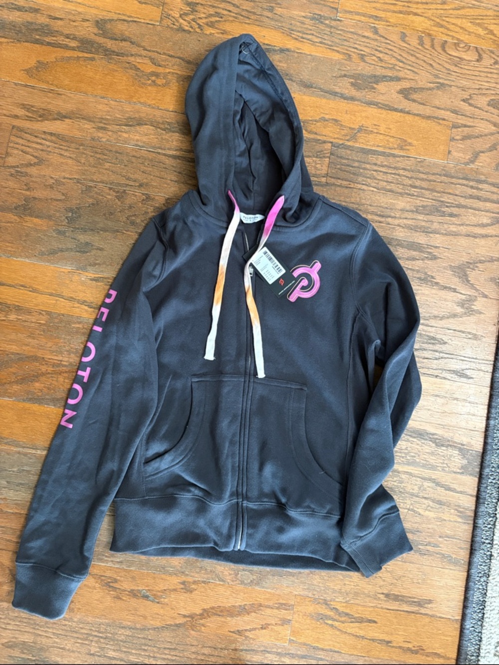 Peloton Black Hoodie with Pink Logo and Sleeve Text